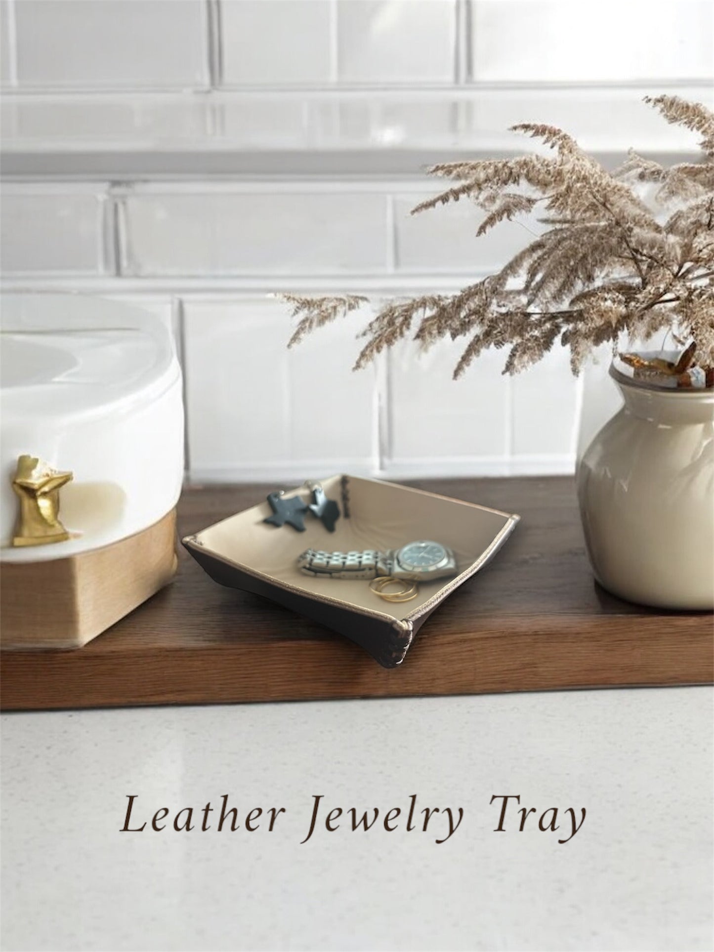 Leather jewelry tray on counter 